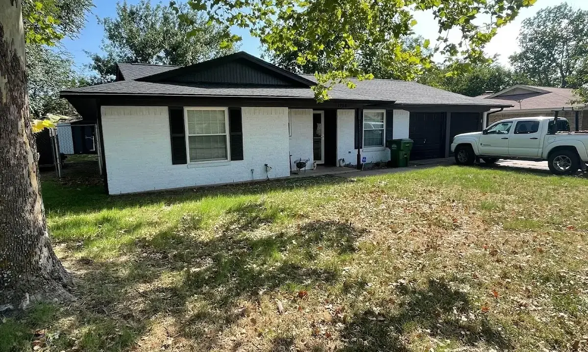Professional roofing crew working on a residential roof in Vandenberg Village